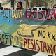 Activists display banners referring to the shutting down of existing oil pipelines in the northern United States at Black Lives Matter Plaza in Washington, DC on April 1, 2021 one block from the White House as US President Joe Biden was holding his first cabinet meeting.